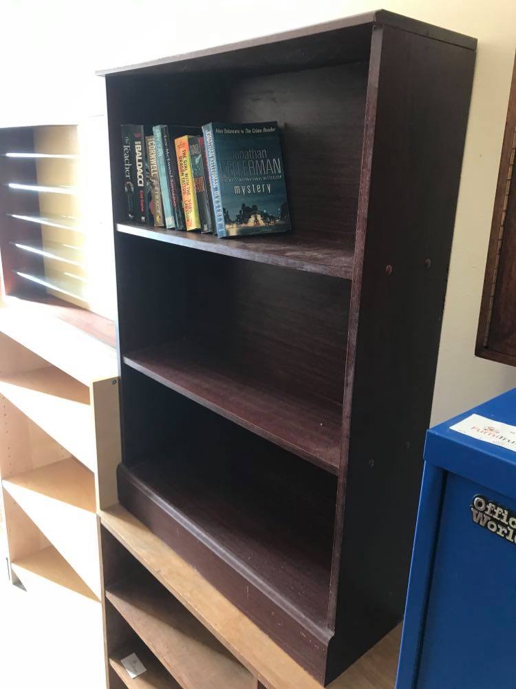 Small bookcase in dark wood finish